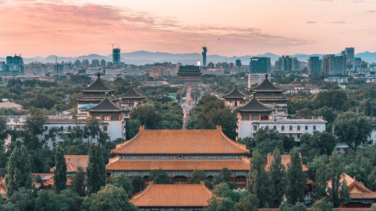 a view of beijing skyline with trees